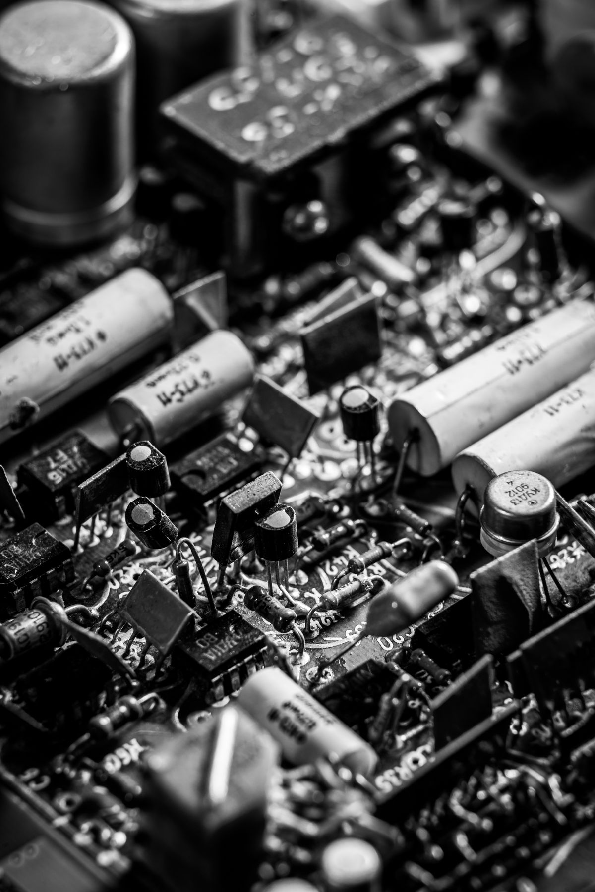 Black-and-white close-up of electronic components on a motherboard